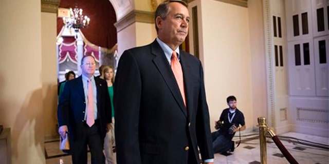 FILE: Oct. 5, 2013: House Speaker John Boehner walks to the chamber as lawmakers vote to pay furloughed federal workers, at the Capitol in Washington, D.C.