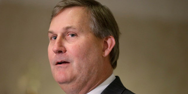 In this April 22, 2014, file photo, Democrat John Burkhalter speaks to members of the Arkansas Farm Bureau at a candidate forum in North Little Rock, Ark.