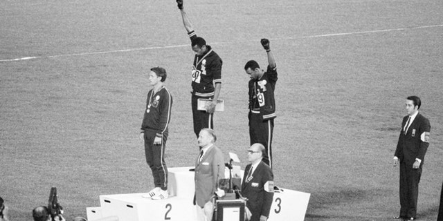 Americans Tommie Smith and John Carlos raised black-gloved fists in the black power salute in protest during the national anthem at the 1968 Mexico Games.