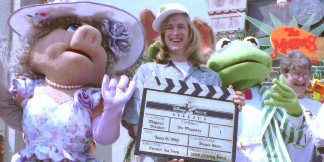 FILE - Puppeteer John Henson, the son of the late Muppets creator Jim Henson is seen with Muppets Miss Piggy and Kermit at the Disney/MGM studios in Lake Buena Vista, Florida in this June 15, 1990 file photo. Cheryl Henson says her brother died of a "massive heart attack" died at his home in Saugerties, New York on Friday Feb. 14, 2014. He was 48. (AP Photo/FILE)