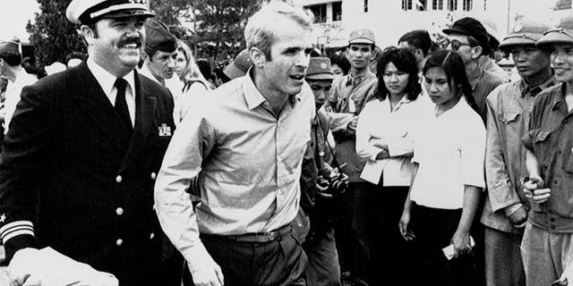 John McCain escorted to Hanoi airport on March 14, 1973 after being released from prison