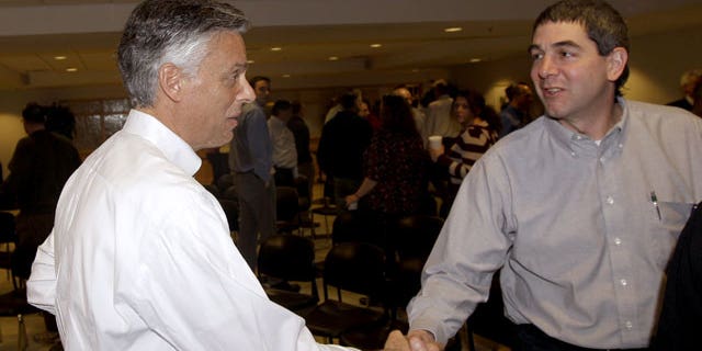 January 5, 2012: Republican presidential candidate, former Utah Gov. Jon Huntsman shakes the hand of an employee after a town hall style meeting at Goss International in Durham, N.H.