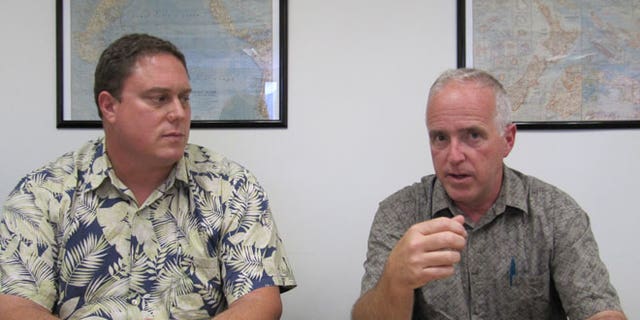 May 10, 2012: John Van Dame, right, U.S. Pacific Fleet senior environmental planner, and Roy Sokolowski, a U.S. Pacific Fleet sonar modeling expert, speak in Honolulu about the Navy's new environmental impact statement for training and testing in Hawaii and California waters.