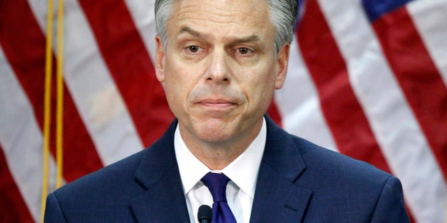FILE - In this Jan. 16, 2012, file photo, former Utah Gov. Jon Huntsman, announces he is ending his campaign for president in Myrtle Beach, S.C. A White House official says Huntsman is President Donald Trump's choice to be the next U.S. ambassador to Russia. Huntsman will take the diplomatic post as senior members of Trump's administration face questions about their contact with the Russian government. (AP Photo/Charles Dharapak, File)