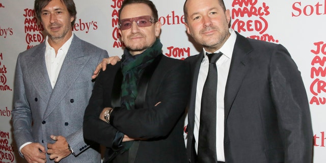 File photo - Designer Marc Newson (L), Singer Bono (C) and Apple's Jony Ive attend Jony And Marc's (RED) Auction at Sotheby's in New York Nov. 23, 2013.