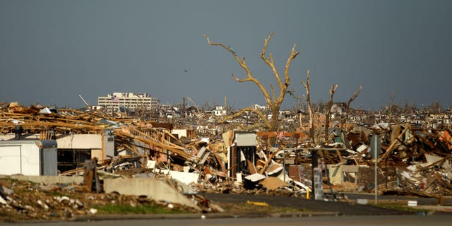 May 30: Damage is seen in a devastated Joplin, Missouri neighborhood. A federal agency was set to release a report today detailing communication efforts ahead of the massive twister that hit Joplin, killing more than 160 people.