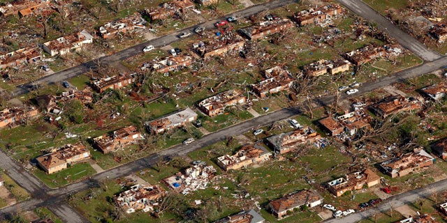 May 24: Aerial file photo shows a neighborhood destroyed by a powerful tornado in Joplin, Mo.