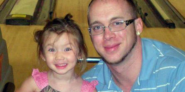 In this undated photo made available by Jordan Arwood, shows him with his daughter Chloe Jade Arwood.