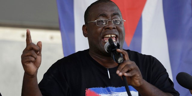 Cuban dissident Jorge Luis Garcia Perez, known by the nickname "Antunez", speaks during a protest against President Barack Obama's plan to normalize relations with Cuba, Saturday, Dec, 20, 2014, in the Little Havana neighborhood of Miami. (AP Photo/Lynne Sladky)