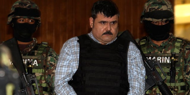 Sept. 13, 2012: Mexican Navy marines escort Jorge Eduardo Costilla Sanchez, aka "El Coss," as he is shown to the press at the Mexican Navy's Center for Advanced Naval Studies in Mexico City.