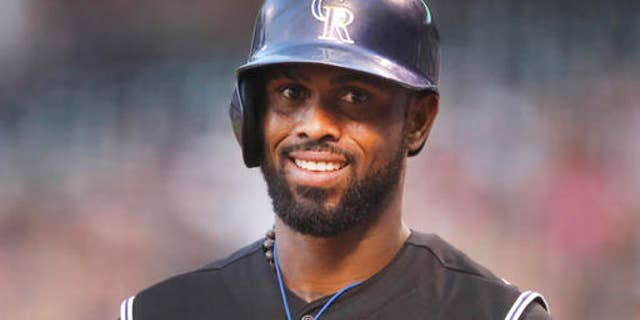 FILE - In this Aug. 21, 2015, file photo, Colorado Rockies shortstop Jose Reyes is seen in the first inning of a baseball game in Denver. Colorados Jose Reyes has been suspended by Major League Baseball through May 31 for violating MLBs domestic violence policy. The unpaid suspension of Reyes is retroactive to February 23, 2016, when Reyes was placed on leave pending the resolution of criminal proceedings in Hawaii. Reyes has agreed not to appeal the discipline. (AP Photo/David Zalubowski, File)