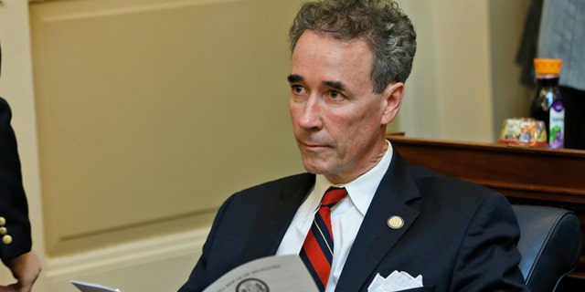 Del. Joe Morrissey, I-Henrico, looks over the calendar during the House session at the Capitol in Richmond, Va., Wednesday, Jan. 21, 2015.