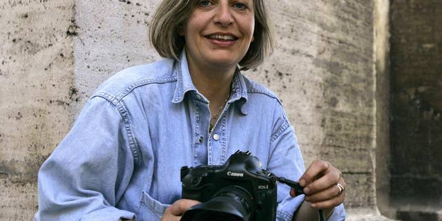 FILE - In this April 7, 2005 file photo, Associated Press photographer Anja Niedringhaus poses in Rome. Niedringhaus, 48, was killed and an AP reporter was wounded on April 4, 2014, when an Afghan policeman opened fire while they were sitting in their car in eastern Afghanistan. At least 60 journalists around the world were killed in 2014 while on the job or because of their work, and 44 percent of them were targeted for murder, the Committee to Protect Journalists says. (AP Photo/Peter Dejong, File)