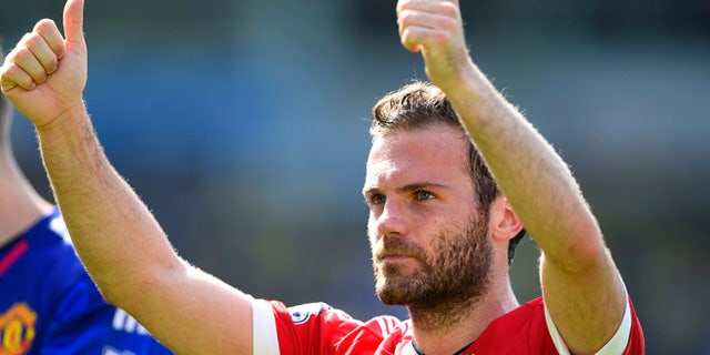 NORWICH, ENGLAND - MAY 07: Juan Mata of Manchester United celebrates his team's 1-0 win in the Barclays Premier League match between Norwich City and Manchester United at Carrow Road on May 7, 2016 in Norwich, England. (Photo by Mike Hewitt/Getty Images)