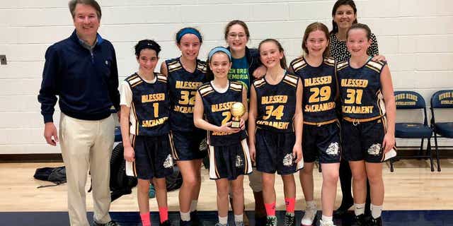 Judge Brett Kavanaugh with his daughter's basketball team, which he coaches.