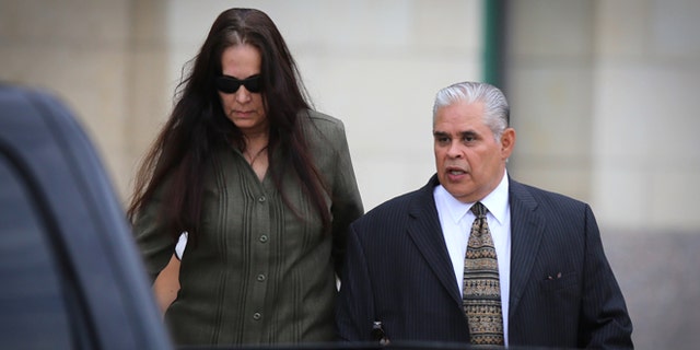 Aug 21, 2013: Former 404th state District Judge Abel Limas, right, quickly exits the federal courthouse in Brownsville, Texas.