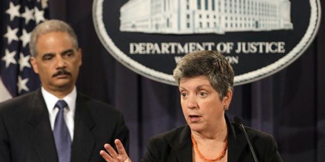 Aug. 3: Attorney General Eric Holder listens at left as Homeland Security Secretary Janet Napolitano speaks at the Justice in Washington, to discuss the results of the largest U.S. prosecution of an international criminal network organized to sexually exploit children.