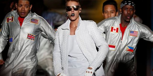 Canada's pop star Justin Bieber performs in concert during his Believe world tour in Asuncion, Paraguay.