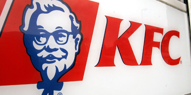 CHICAGO - AUGUST 15: KFC signage is visible on a door of a cigarette-smoke-free company-owned KFC restaurant August 15, 2005 in Chicago, Illinois. Louisville, Kentucky-based Yum! Brands' company-owned 1,200 KFC and 1,675 Pizza Hut restaurants starting this week will be enacting a no smoking policy, placing "No Smoking" signs in their US restaurants owned by the company. The company is encouraging their other 4,200 KFC and 4,600 Pizza Hut franchised restaurants in the US to follow. (Photo by Tim Boyle/Getty Images)