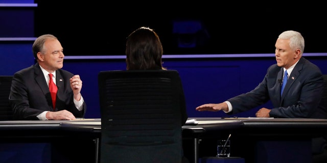 Republican vice-presidential nominee Gov. Mike Pence, right, and Democratic vice-presidential nominee Sen. Tim Kaine answer a question during the vice-presidential debate at Longwood University in Farmville, Va., Tuesday, Oct. 4, 2016. (AP Photo/David Goldman)