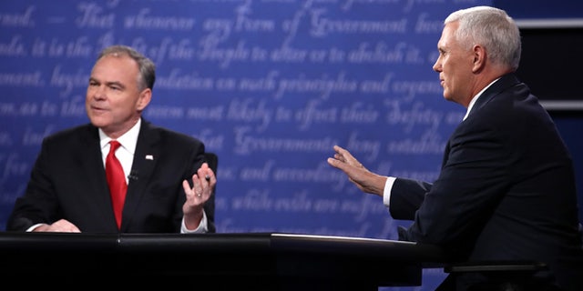 Democratic vice presidential nominee Tim Kaine (L) and Republican vice presidential nominee Mike Pence (R) speak during the Vice Presidential Debate at Longwood University on October 4, 2016 in Farmville, Virginia. This is the second of four debates during the presidential election season and the only debate between the vice presidential candidates. (Photo by Win McNamee/Getty Images)