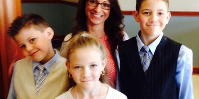 Karey Cooper with three children from her first case as a social worker.