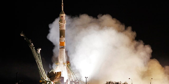 The Soyuz-FG rocket booster with Soyuz TMA-02M space ship carrying a new crew to the International Space Station, ISS, blasts off from the Russian leased Baikonur cosmodrome, Kazakhstan, Wednesday, June 8, 2011. The Russian rocket carries U.S. astronaut Michael Fossum, Russian cosmonaut Sergey Volkov  and Japanese astronaut Satoshi Furukawa.