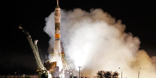 The Soyuz-FG rocket booster with Soyuz TMA-02M space ship carrying a new crew to the International Space Station, ISS, blasts off from the Russian leased Baikonur cosmodrome, Kazakhstan, Wednesday, June 8, 2011. The Russian rocket carries U.S. astronaut Michael Fossum, Russian cosmonaut Sergey Volkov and Japanese astronaut Satoshi Furukawa.
