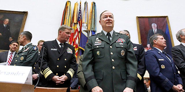 Sept. 23, 2010: Army Gen. Keith B. Alexander, commander of the U.S. Cyber Command, center, arrives on Capitol Hill in Washington to testify before the House Armed Services Committee hearing on cyberspace operations.