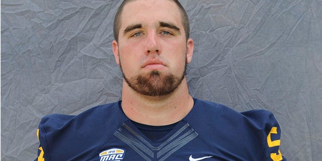 Aug. 2014: Jason Bitsko poses during football photo day in Kent, Ohio.
