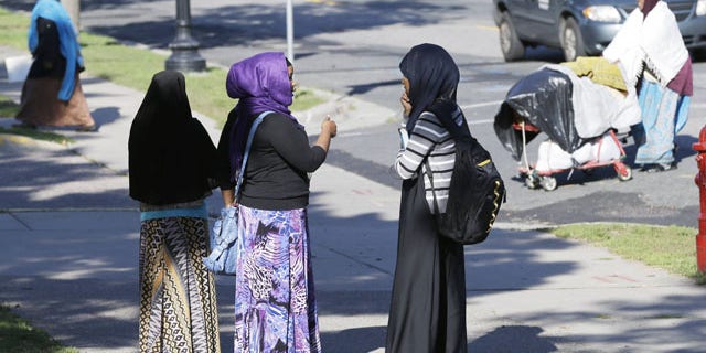 September 24, 2013: Members of the Somali community visit near a park in Minneapolis. It's been six years since Minnesota first began furnishing young fighters to al-Shabab, the terror group that has claimed responsibility for the deadly mall attack in Kenya. (AP Photo)