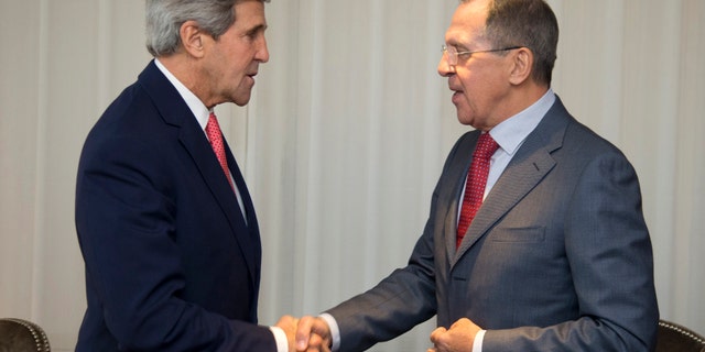 Nov. 23, 2013: U.S. Secretary of State John Kerry (L) and Russia's Foreign Minister Sergei Lavrov shake hands during a photo opportunity prior to their meeting, in Geneva.