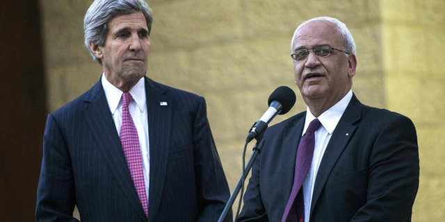 Jan. 4, 2014: Secretary of State John Kerry, left, and Palestinian negotiator Saeb Erekat at the Palestinian in the West Bank city of Ramallah.