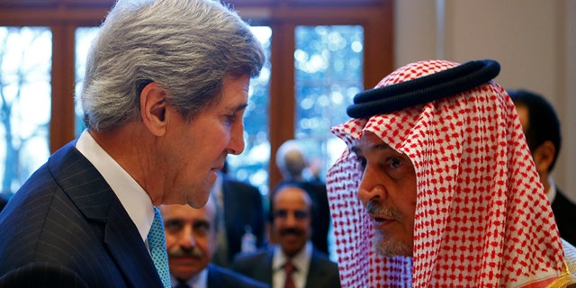 Jan. 22, 2014: Secretary of State John Kerry talks to Saudi Arabia's Foreign Minister Prince Saud al-Faisal in Montreux, Switzerland.