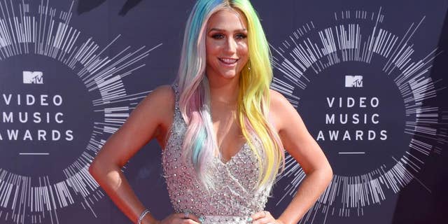 FILE - In this Aug. 24, 2014 file photo, Kesha arrives at the MTV Video Music Awards at The Forum in Inglewood, Calif. Attorneys for music producer Lukasz Gottwald, known professionally as Dr. Luke, filed a motion in Los Angeles Superior Court on Monday, Nov. 17, 2014, seeking the dismissal of claims made by the pop singer, Kesha, that she was raped by her mentor. Gottwald's filings argue that the claims are barred by the statue of limitations. (Photo by Jordan Strauss/Invision/AP, File)