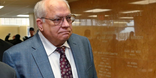 April 21, 2015: Robert Bates arrives for his arraignment at the Tulsa County courthouse in Tulsa, Okla. Bates, a 73-year-old Tulsa County reserve deputy, fatally shot a suspect who was pinned down by officers. (AP Photo/Sue Ogrocki, File)