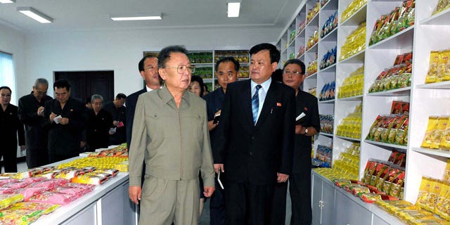 In this undated photo released by Korean Central News Agency via Korea News Service in Tokyo on Thursday, Aug. 26, 2010, North Korean leader Kim Jong Il, foreground, visits Pyongyang Cornstarch Factory in Pyongyang, North Korea. (AP)
