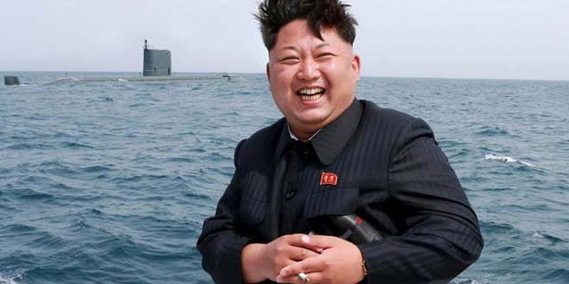 May 9: North Korean leader Kim Jong Un watches the test-fire of a strategic submarine underwater ballistic missile (not pictured), in this undated photo released by North Korea's Korean Central News Agency in Pyongyang.
