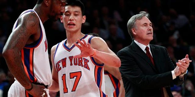 Feb. 15: New York Knicks' Jeremy Lin (17) talks to teammate Amare Stoudemire (1) as head coach Mike D'Antoni calls out to the team during the first half of an NBA basketball game against the Sacramento Kings.