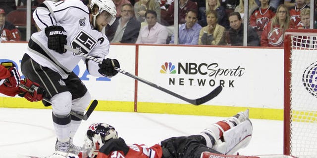 May 30, 2012: Los Angeles Kings' Anze Kopitar, of Slovenia, scores past New Jersey Devils' Martin Brodeur during overtime in Game 1 of the NHL hockey Stanley Cup finals in Newark, N.J. The Kings won 2-1.
