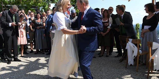 Austria's Foreign Minister Karin Kneissl dances with Russia's President Vladimir Putin at her wedding in Gamlitz, Austria, August 18, 2018. Roland Schlager/Pool via Reuters