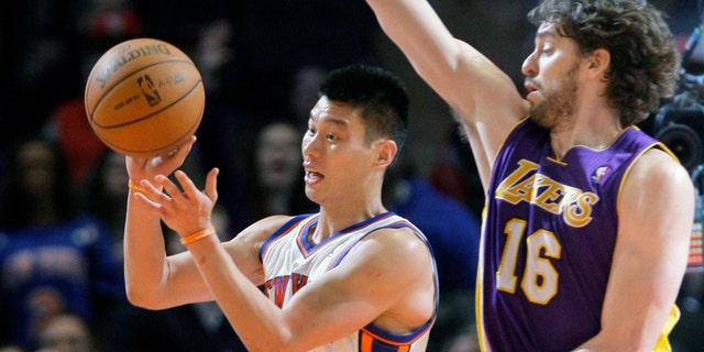 New York Knicks' Jeremy Lin (17) passes away from Los Angeles Lakers' Pau Gasol (16), of Spain, during the second half of an NBA basketball game Friday, Feb. 10, 2012, in New York. The Knicks won the game 92-85. (AP Photo/Frank Franklin II)