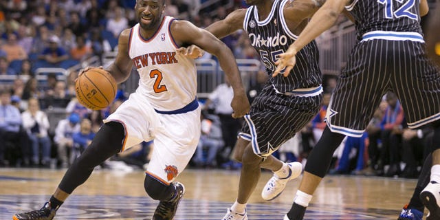 February 21, 2014: New York Knicks' Raymond Felton (2) dribbles around Orlando Magic's E'Twaun Moore (55) and Tobias Harris (12) during an NBA basketball game in Orlando, Fla. The Magic won 129-121 in two overtimes. (AP Photos/Willie J. Allen Jr.)