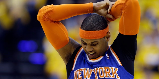 New York Knicks' Carmelo Anthony stretches during the first half of Game 3 of an Eastern Conference semifinal NBA basketball playoff series against the Indiana Pacers on Saturday, May 11, 2013, in Indianapolis. (AP Photo/Darron Cummings)