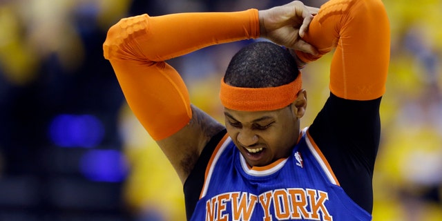 New York Knicks' Carmelo Anthony stretches during the first half of Game 3 of an Eastern Conference semifinal NBA basketball playoff series against the Indiana Pacers on Saturday, May 11, 2013, in Indianapolis. (AP Photo/Darron Cummings)