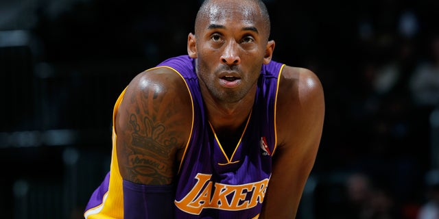 ATLANTA, GA - DECEMBER 16: Kobe Bryant #24 of the Los Angeles Lakers stands during a free throw against the Atlanta Hawks at Philips Arena on December 16, 2013 in Atlanta, Georgia. NOTE TO USER: User expressly acknowledges and agrees that, by downloading and or using this photograph, User is consenting to the terms and conditions of the Getty Images License Agreement. (Photo by Kevin C. Cox/Getty Images)