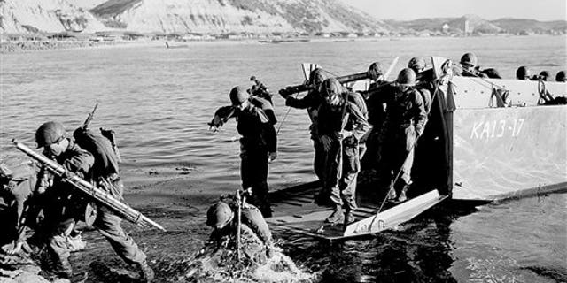 FILE - Troops of the First U.S. Cavalry Division land ashore at Pohang on the east coast of Korea during the Korean War.