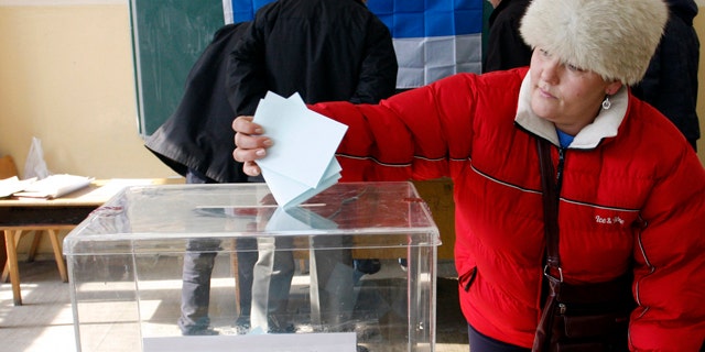 Feb. 14, 2012- A woman casts his ballot at the poilling station in Zvecan, Kosovo. Defiant Serbs in northern Kosovo voted Tuesday in a referendum that is likely to overwhelmingly reject Kosovo's ethnic Albanian rule, further hindering Serbia's attempts to join the European Union.