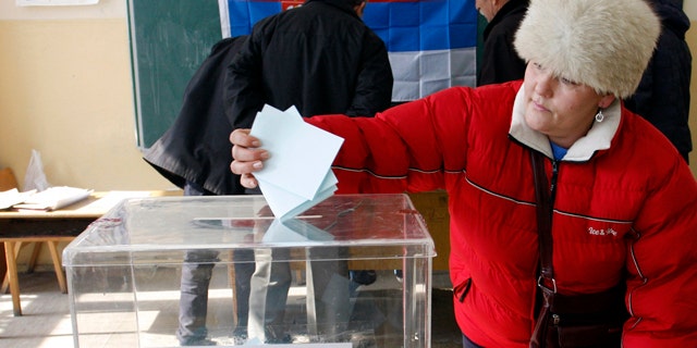 Feb. 14, 2012- A woman casts his ballot at the poilling station in Zvecan, Kosovo. Defiant Serbs in northern Kosovo voted Tuesday in a referendum that is likely to overwhelmingly reject Kosovo's ethnic Albanian rule, further hindering Serbia's attempts to join the European Union.