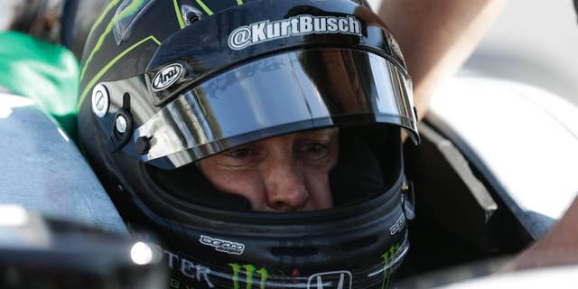Race driver Kurt Busch practices at the Indianapolis Motor Speedway during the Rookie Orientation Program in Indianapolis, Tuesday, April 29, 2014. Busch will try to be the first driver in a decade to compete in IndyCar's Indianapolis 500 and Sprint Cup's Coca-Cola 600 on the same day. (AP Photo/Michael Conroy)